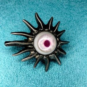 Vintage prosthetic eye pendent or clip by Kali jewelry